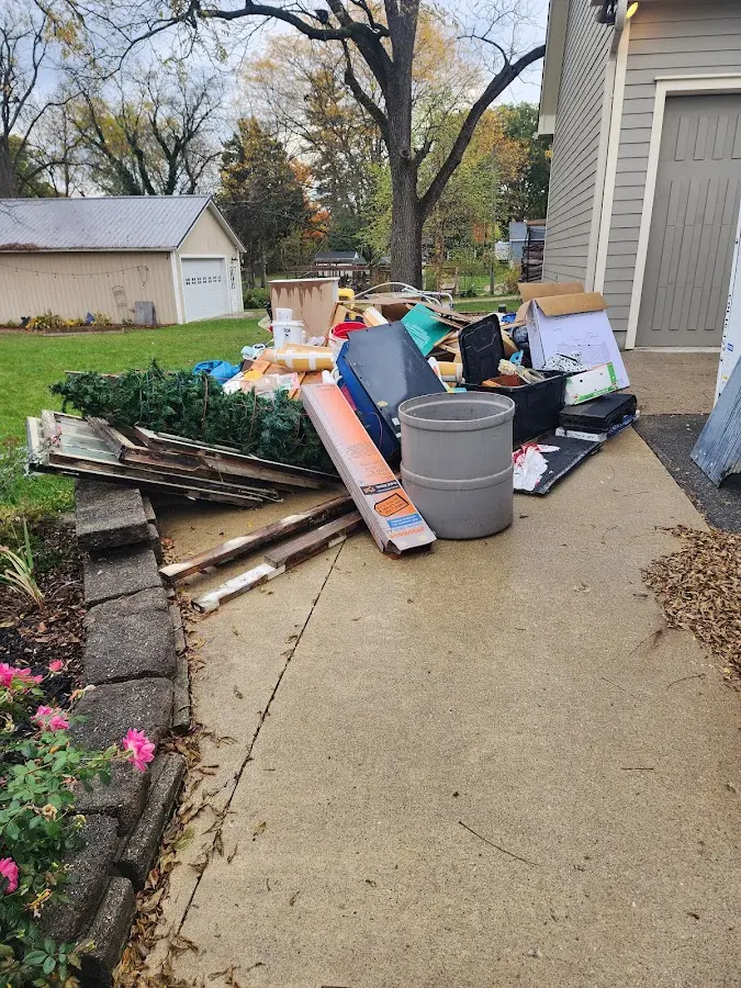 Dumpster being loaded with debris for 12 Yard Dumpster Rental in Sunnyvale